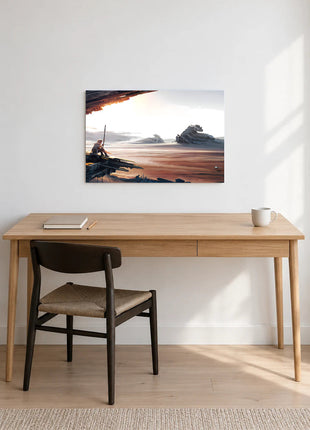 Rey Beyond the Wreckage acrylic wall art displayed above a wooden desk with a notebook, pencil and white mug against a white wall.