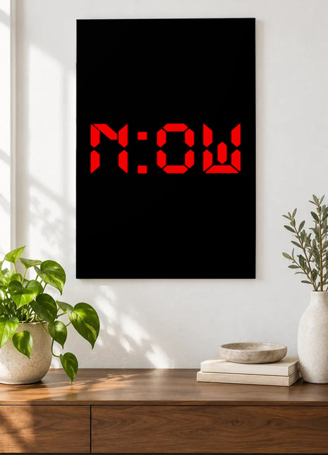 Right Now Digital acrylic wall art displayed above a wooden console with plants and books against a white wall.