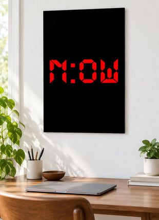 Right Now Digital acrylic wall art displayed above a wooden desk with a laptop, plants and books against a white wall.