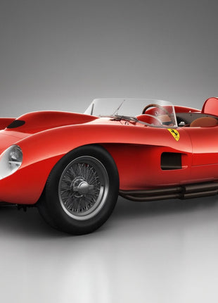 Red Ferrari vintage racing barchetta with sculpted front fenders, wire wheels, an open cockpit and side exhaust on a gray studio floor.