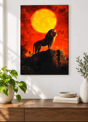 Lion standing on a dark rock below an enormous golden sun in a red-orange sky displayed above a console table in a room setting