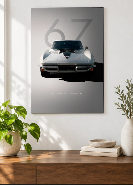 Silver Sixty-Seven car wall art displayed above a walnut console against a white wall