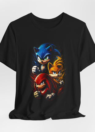 Draped front view of a black T-shirt with Sonic above Tails and Knuckles amid blue, gold and red textured strokes.