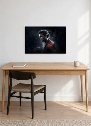 Spider-Man Quiet in the Rain acrylic wall art displayed above a wooden desk with a notebook, pencil and white mug against a white wall.