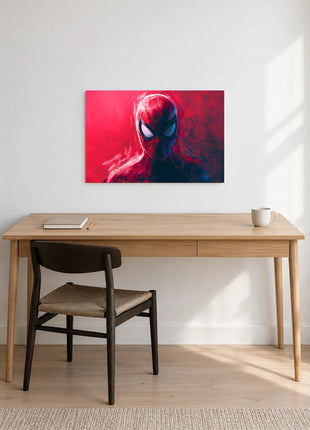 Spider-Man Scarlet Signal acrylic wall art displayed above a wooden desk with a notebook, pencil and white mug against a white wall.