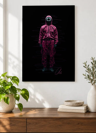 Square Mask in Pink acrylic wall art displayed above a wooden console with plants and books against a white wall.