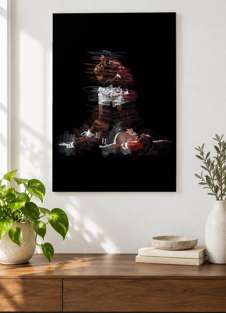 Standing Above the Count acrylic wall art displayed above a wooden console with plants and books against a white wall.
