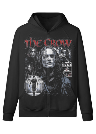 Front of a black The Crow zip-up hoodie with an Eric Draven portrait collage, smaller film images and distressed red lettering across the zipper.