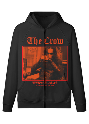 Front of a black The Crow zip-up hoodie with a framed red-orange scene of seated Eric Draven beneath gothic title lettering.