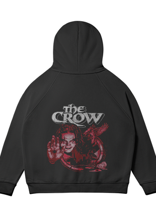 Rear view of The Crow Raised Hand black hoodie with the hood raised above the matching Eric Draven and red crow composition.