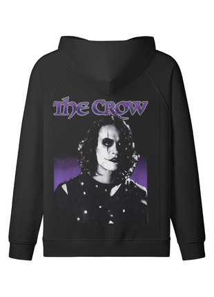 Back of the black The Crow Violet Shadows hoodie with the monochrome Eric Draven portrait, violet title lettering and purple backdrop beneath the lowered hood.