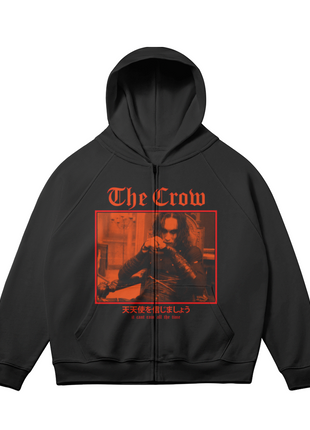 Alternate front view of the black The Crow Crimson Room zip-up hoodie, with the red-orange seated Eric Draven scene and gothic title lettering and sleeves angled outward.