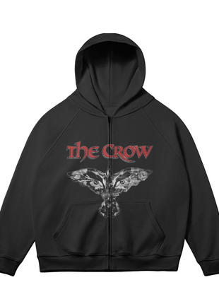 Alternate front view of the black The Crow Winged Eyes zip-up hoodie, with the white-gray winged crow-and-eyes emblem and red title lettering and sleeves angled outward.