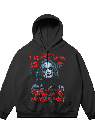 Alternate front view of the black The Crow Chamber Door zip-up hoodie, with the blue-gray Eric Draven portrait and red chamber door quote lettering and sleeves angled outward.