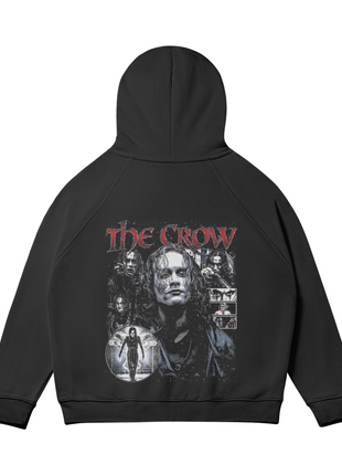 Rear view of the black The Crow Eric Draven Collage hoodie with the hood raised, showing the Eric Draven portrait collage and distressed red title lettering across the back.