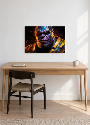 Thanos Gilded Reckoning acrylic wall art displayed above a wooden desk with a notebook, pencil and white mug against a white wall.