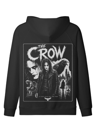 Back of a black zip-up hoodie with a monochrome Eric Draven collage, crow, city skyline and The Crow lettering.