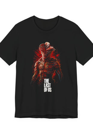 Front of black T-shirt showing a fungal infected creature with layered head growths, red brushwork and white The Last of Us lettering.