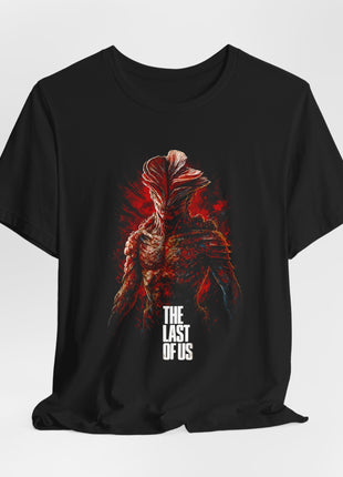 Draped black T-shirt with gathered hem showing a fungal infected creature with layered head growths, red brushwork and white The Last of Us lettering.