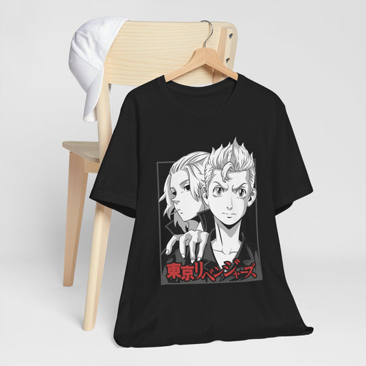 Alt: Tokyo Duo Anime Shirt on black, hanging on chair with cap, lifestyle display by Snapping Turtle Gallery

