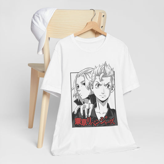 Alt: Tokyo Duo Anime Shirt on white, hanging on chair with cap, lifestyle display by Snapping Turtle Gallery

