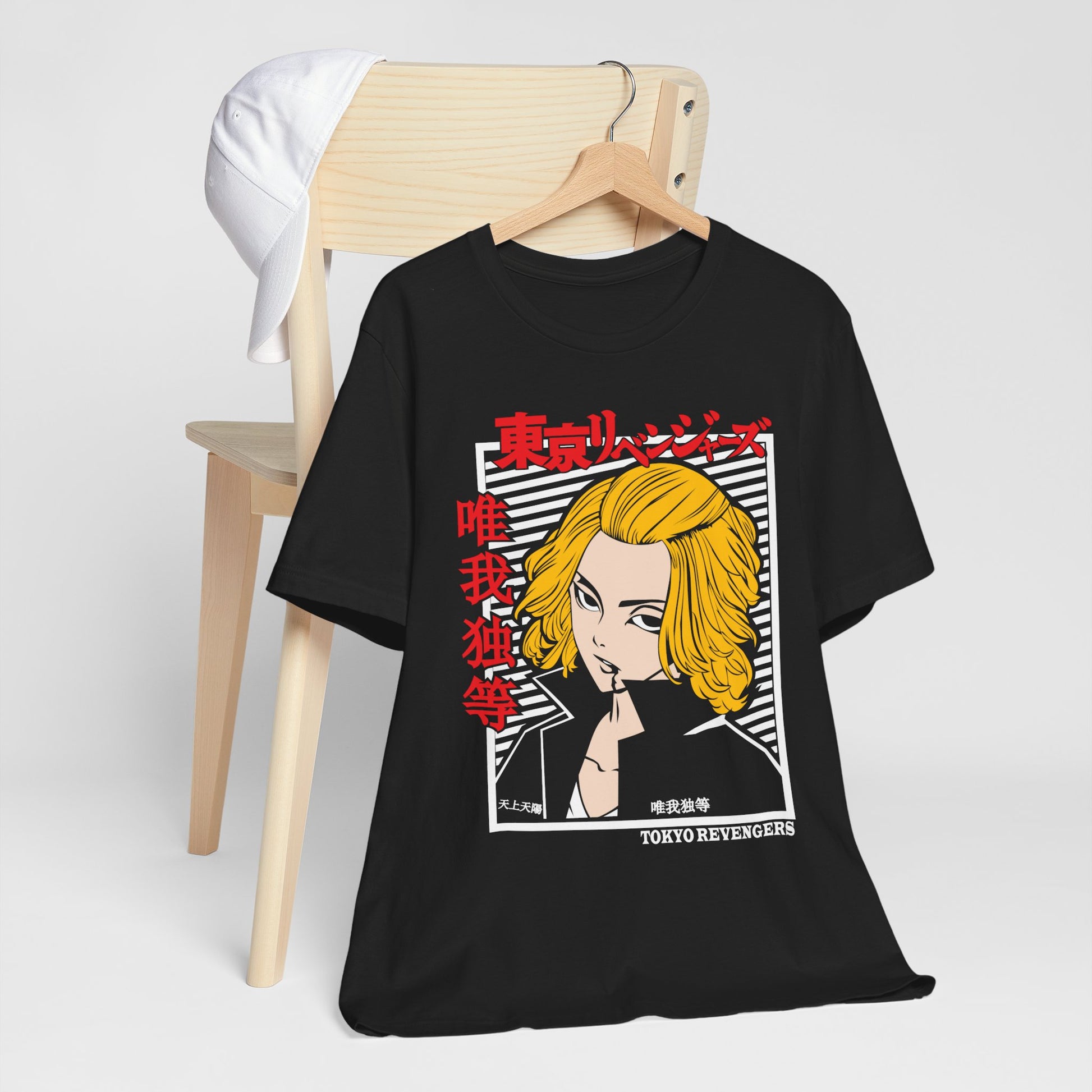 Alt: Tokyo Gang Leader Anime Shirt on black, hanging on chair with cap, lifestyle display by Snapping Turtle Gallery

