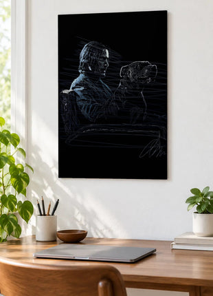 Two Profiles in the Blue Dark acrylic wall art displayed above a wooden desk with a laptop, plants and books against a white wall.
