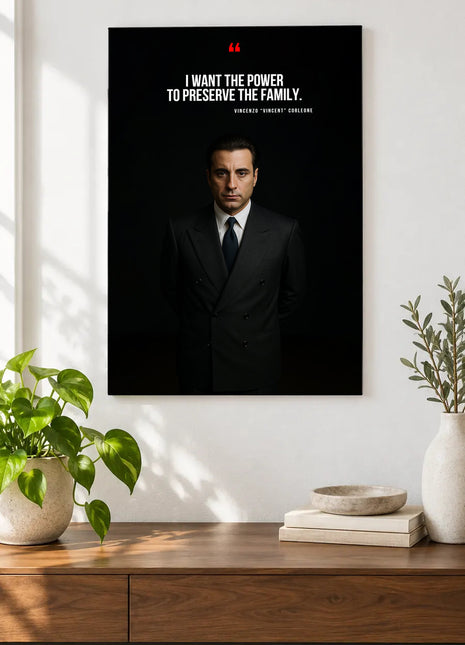 Vincent Corleone Family Resolve acrylic wall art displayed above a wooden console with plants and books against a white wall.