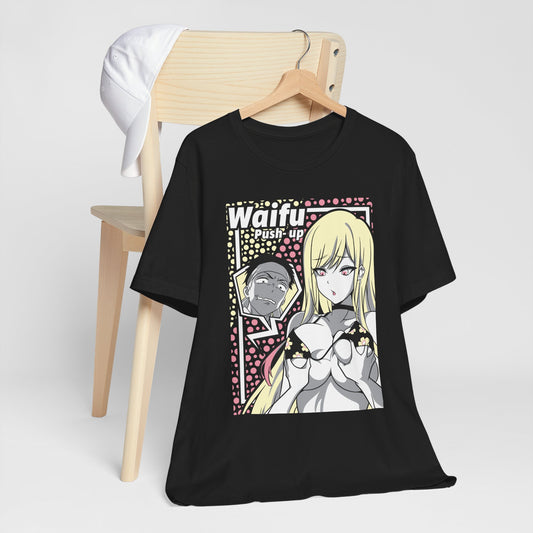 Alt: Waifu Push-Up Anime Shirt on white, hanging on chair with cap, lifestyle display by Snapping Turtle Gallery

